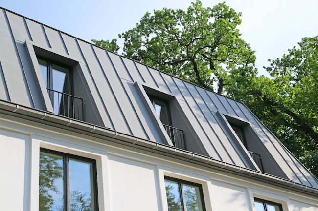 Zinc is a beautiful option for ornate architectural elements because it is easily foldable. Despite its flexibility, it is still strong and durable, resistant to both erosion and cracking. Zinc roofing can last 80 to 100 years.